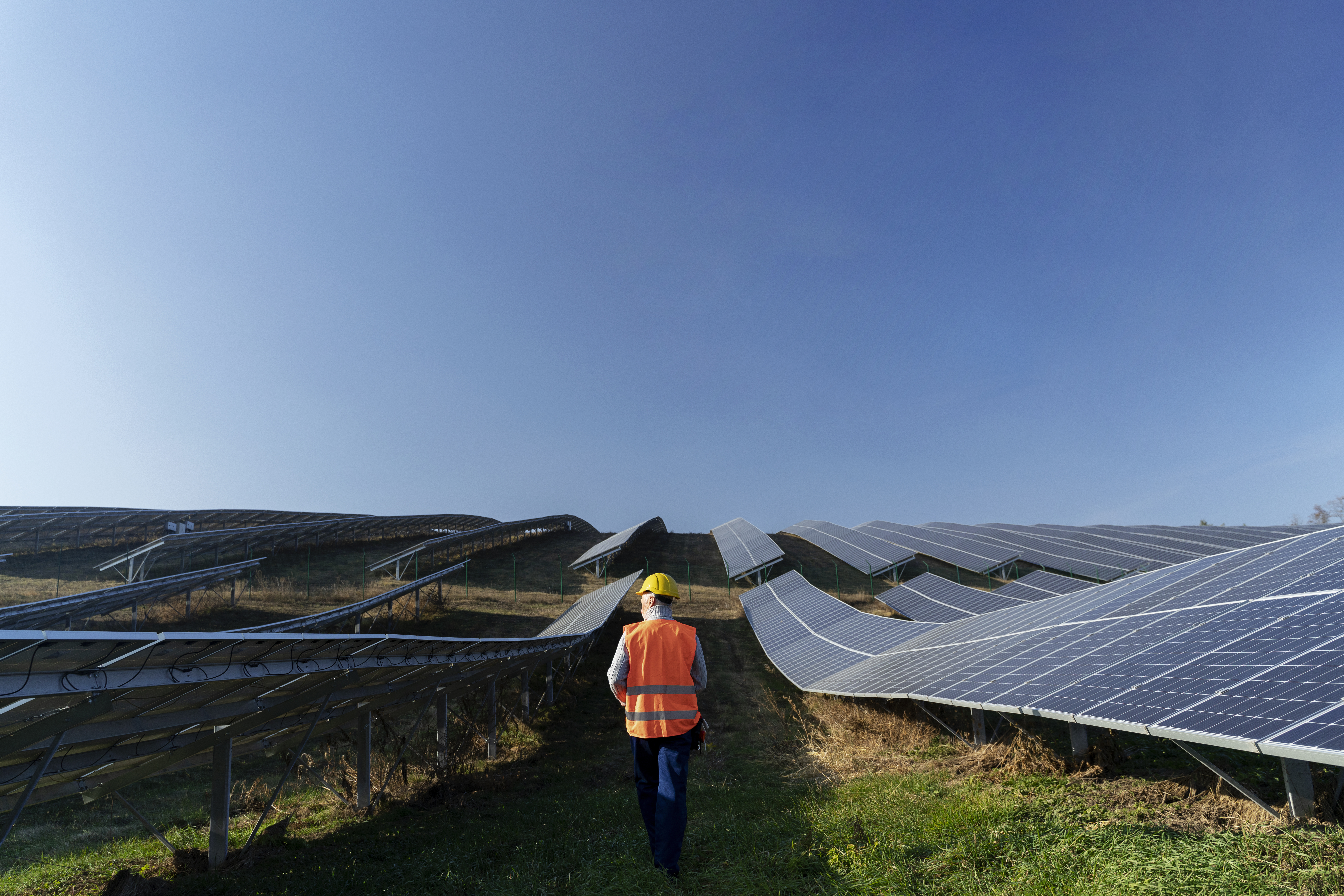 person-near-alternative-energy-plant
